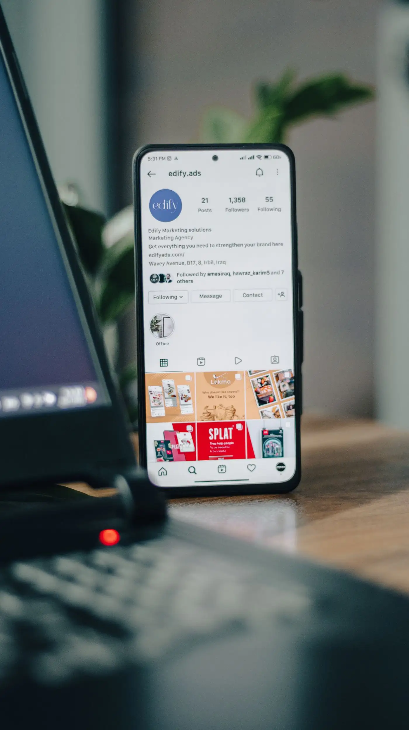 Smartphone and laptop showing an Instagram profile - what is Meta Ads